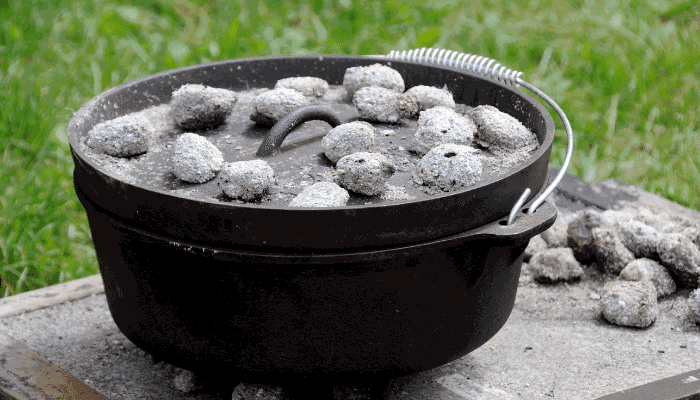 Why do some people put coals in the lid of a Dutch oven whilst